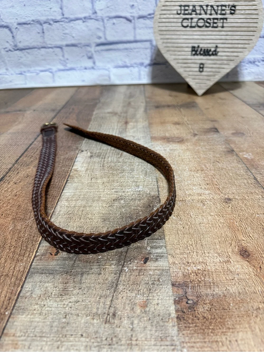 Brown leather braided belt size 31 with brass buckle